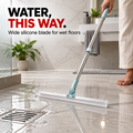 SwishWipe pushing water across bathroom tile